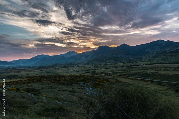 Fototapeta colored clouds at sunset in the mountains of Leon, spain