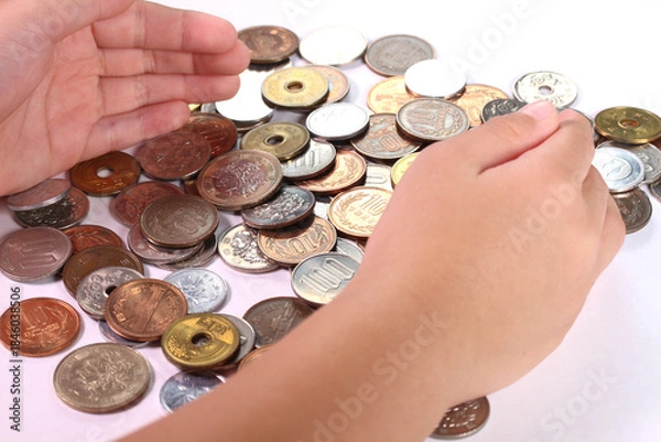 Obraz 小銭と子どもの手