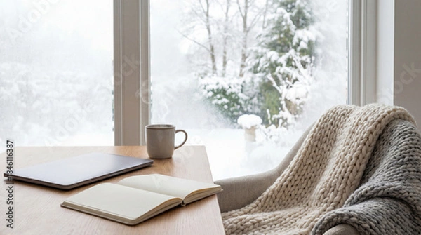 Obraz 雪景色の窓辺でリモートワークする冬のホームオフィス温かいマグカップとミニマルデスク背景余白あり-生成AI