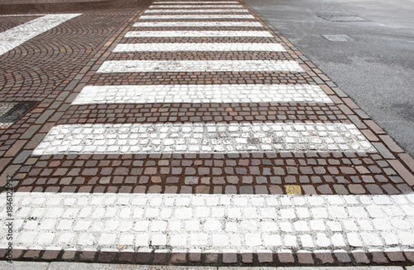 Obraz Crosswalk marking on tiles road