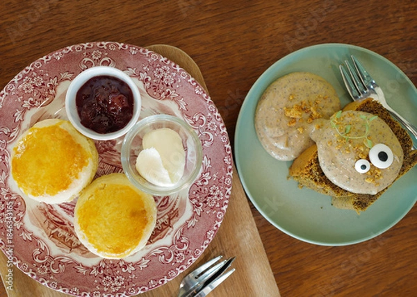 Obraz Close up Earl grey cake and butter scone served with clotted cream and strawberry jam