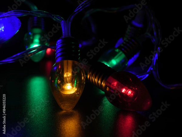 Obraz Vibrant Christmas Lights Glowing in Low Key Darkness