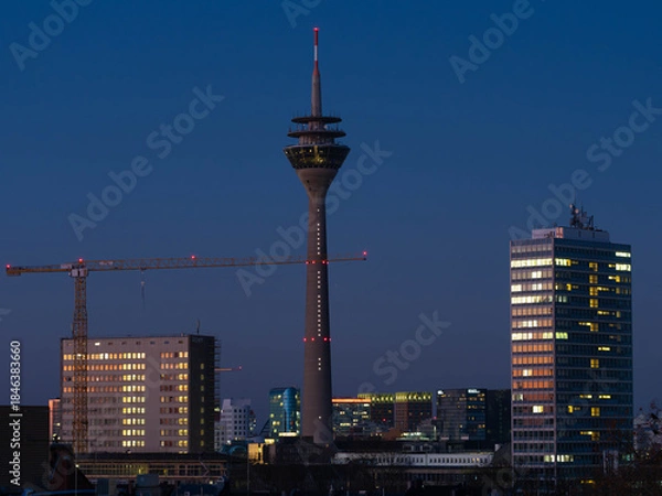 Fototapeta Series of three Pictures of the Rheinturm in Duesseldorf in the Dawn of Day - Different Lightnings. High quality photo