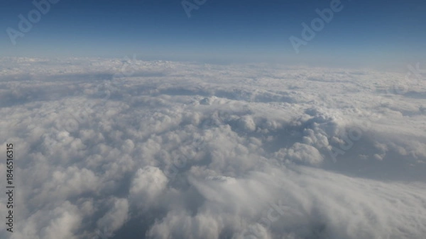 Obraz Cloud Sea and Blue Sky Seen from an Airplane on the Way to Jeju Island in Winter