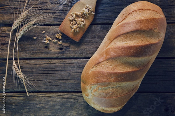 Obraz white bread on a wooden table