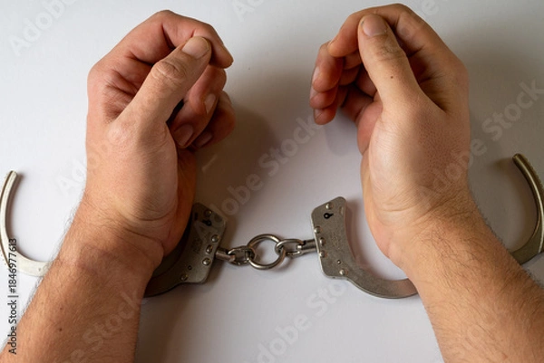 Obraz Hands In Handcuffs On White Background