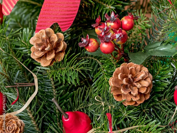 Fototapeta natural spruce branches decorated with pine cones