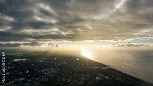 Fototapeta Dramatic skyline with city below