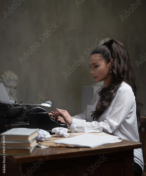 Obraz female writer working at a typewriter