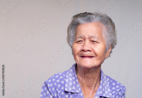 Obraz Elderly woman with toothless smile and natural expression.