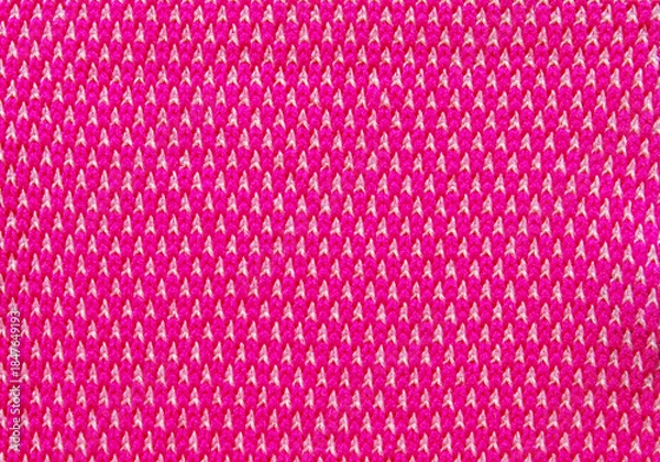 Fototapeta Pink spotted interlock pattern fabric as background