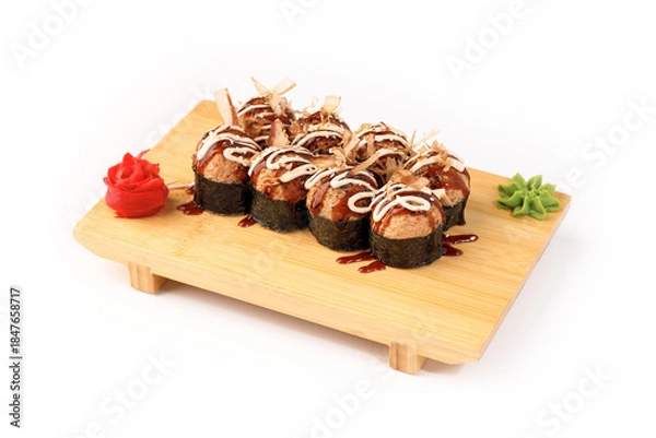 Obraz Fresh sushi rolls artfully arranged on a wooden platter
