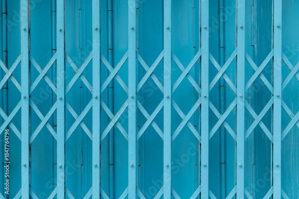 Obraz Blue expandable steel gate showing a traditional folding mechanism
