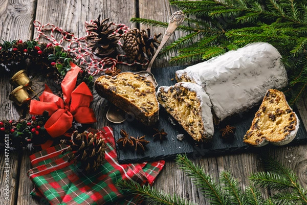 Fototapeta Stollen with filling of raisins, candied fruit