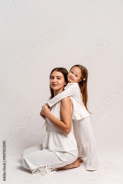 Fototapeta a newborn baby in its mother's arms, the mother soothes the baby before bedtime by rocking it to sleep