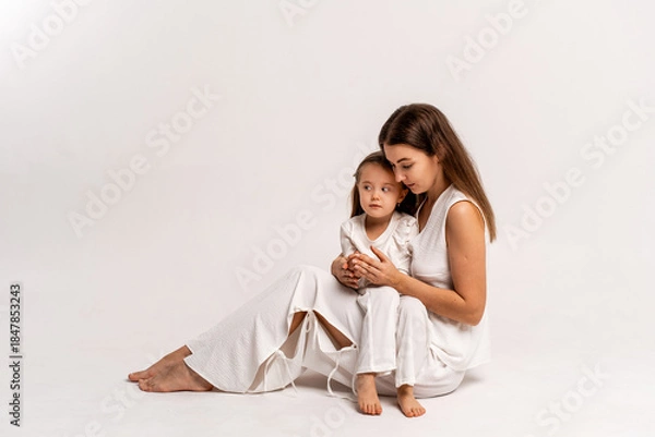 Fototapeta a newborn baby in its mother's arms, the mother soothes the baby before bedtime by rocking it to sleep