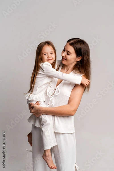 Fototapeta a newborn baby in its mother's arms, the mother soothes the baby before bedtime by rocking it to sleep