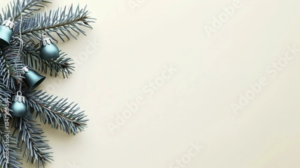 Obraz Christmas tree branches with blue ornaments on a beige background
