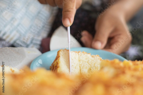 Obraz Close-Up of Knife Cutting Fluffy Cheese Bread