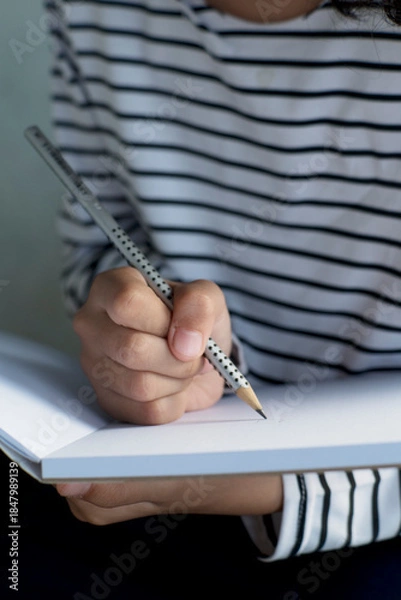 Obraz teenager with creative Note Taking a Notebook