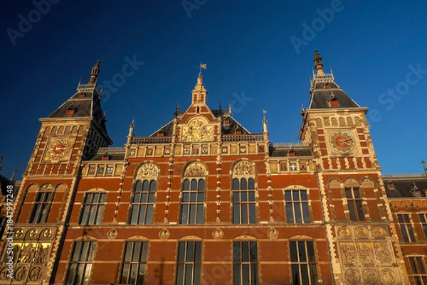 Obraz amsterdam central station at sunset