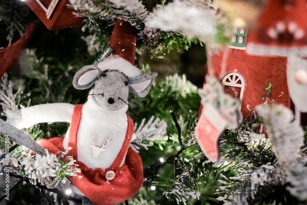 Fototapeta Christmas decorations on the branches of an artificial Christmas tree