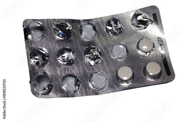 Fototapeta A package of pills on a white background for medical or pharmaceutical use