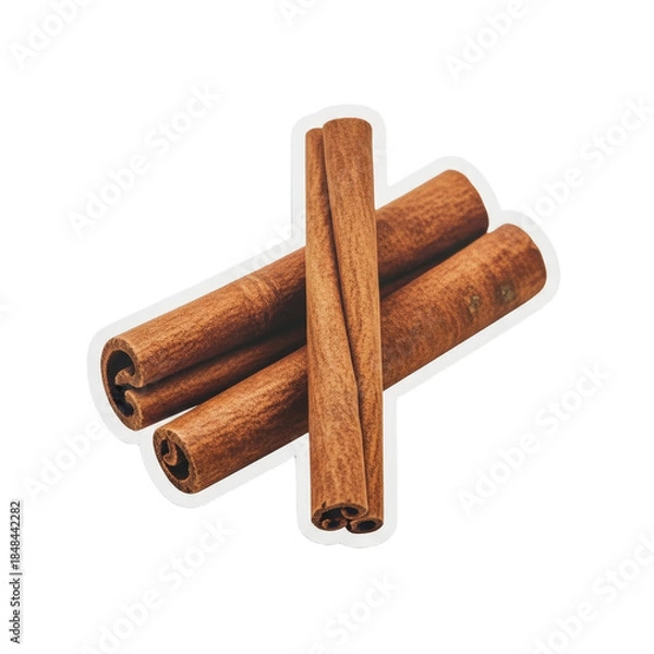 Obraz Cinnamon sticks arranged in a cross pattern on a white background