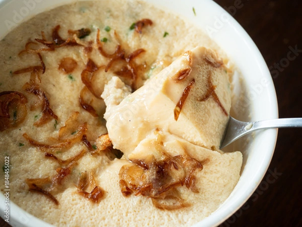 Obraz scooping steamed egg with crispy shallot