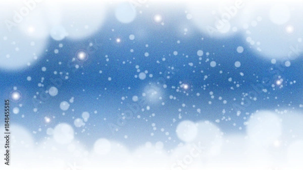 Obraz 淡い青色の空に雪が舞う幻想的な冬の背景
