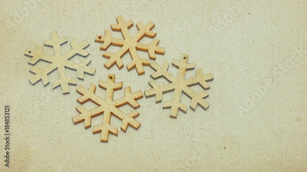 Fototapeta Wooden stars in retro style covered with sepia-colored texture. Image showing the festive atmosphere in the form of a Christmas card.