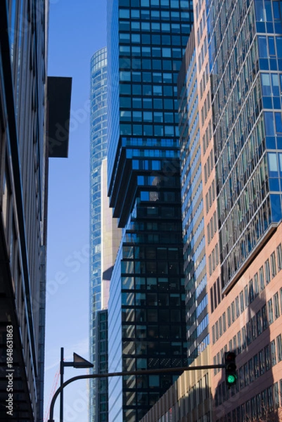 Obraz Looking up modern skyscrapers at financial district at German city of Frankfurt on a sunny autumn day. Photo taken November 22nd, 2025, Frankfurt am Main, Germany.