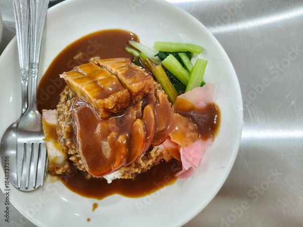 Fototapeta Top view of red pork and crispy pork rice on the table, a delicious Thai dish. with copy space
