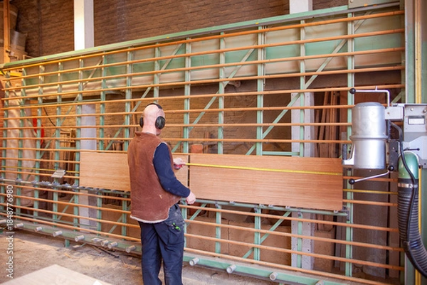 Fototapeta Adjusting large sawing machine