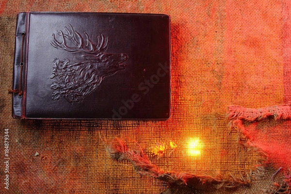 Fototapeta Old photo album. The texture of the fabric. Rough cloth Old cloth. Backgrounds for creativity.Torn fabric. The shade of red.