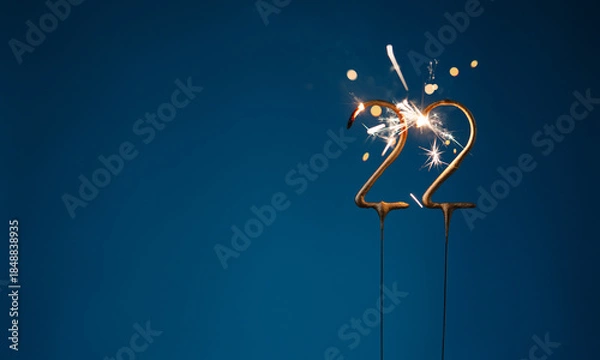 Obraz 22 years celebration festive background with copy space made with Bengal fires in the form of number Twenty two.