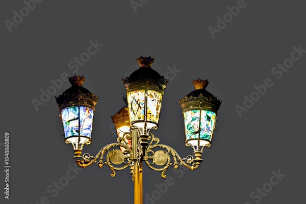 Fototapeta Lamppost decorated with colored glass	