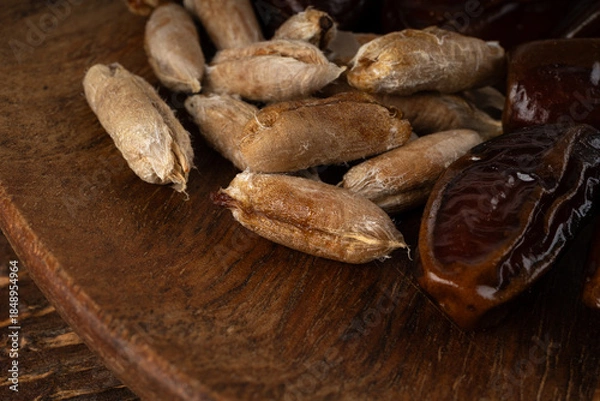 Fototapeta Date seeds and date stones with macro texture