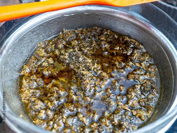 Obraz Boiling Cannabis in Butter Double Boiler: Marijuana Infusion Cooking Process Bubbles Steam Cannabutter Making Method