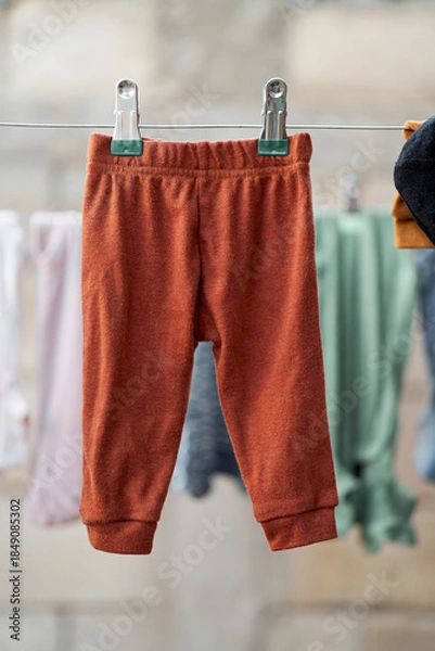 Obraz Infant pants hanging with blurred background