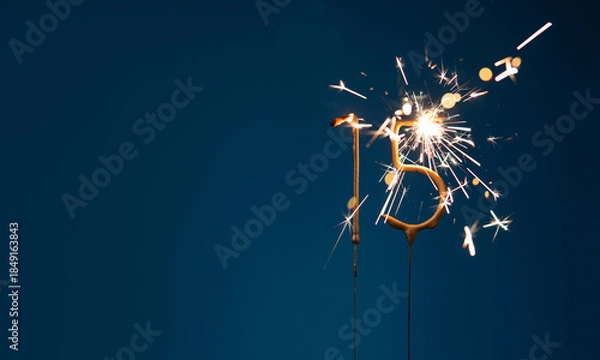 Obraz 15 years anniversary celebration festive background with copy space made with Bengal fires in the form of number Fifteen.