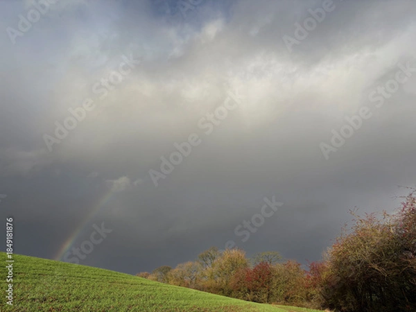 Obraz Bright sunny afternoon in late November in the countryside with a rainbow, North Yorkshire, England, United Kingdom