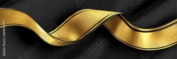 Obraz Elegant golden ribbon flowing gracefully against a dark background, perfect for decoration and design projects.