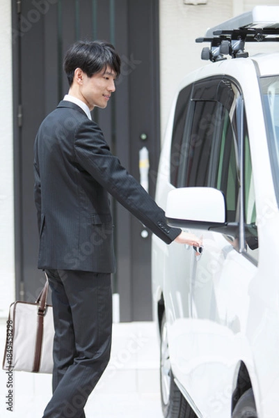 Obraz 自動車のドアを開けるビジネスマン