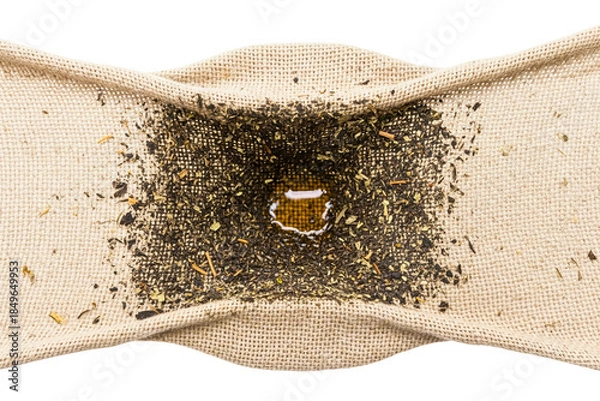Obraz Filtering tea liquid through rustic burlap fabric mesh on a transparent background