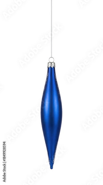 Fototapeta Shiny royal blue spindle-shaped Christmas ornament with silver glitter accents on the ridges isolated.
