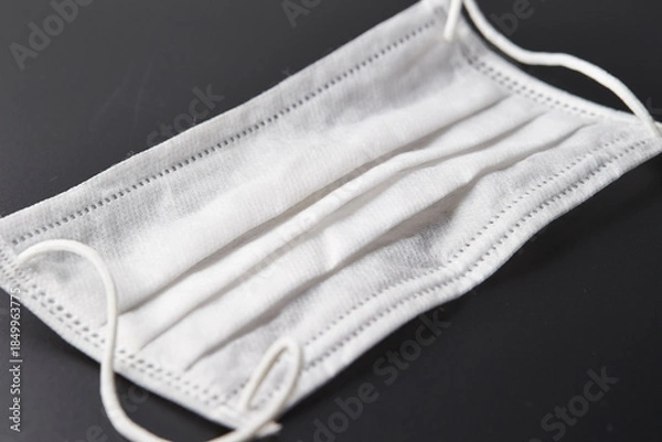 Fototapeta Sanitary mask on black background