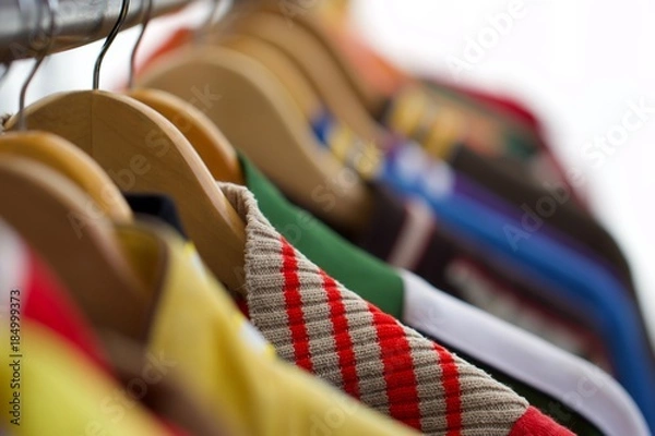 Obraz A hanger with multi coloured clothes 