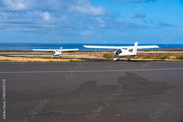 Obraz France, Réunionn Island, taking off of a light aircraft planes at Pierrfonds airport.