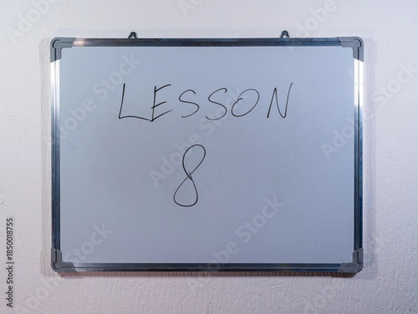 Obraz Whiteboard showing LESSON message representing knowledge transfer, training and skill development